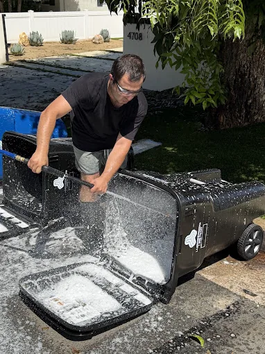 Say Wash It crew washing and sanitising a wheeled bin