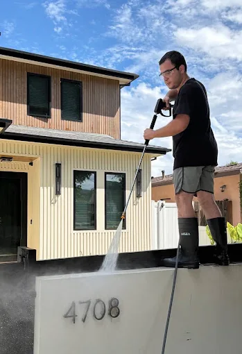Say Wash It crew soft washing an exterior wall in Los Angeles