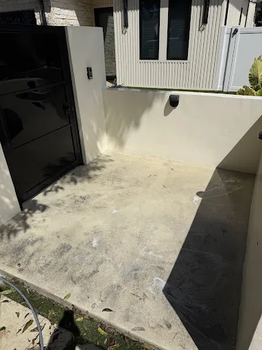 Stained concrete entryway before cleaning by Say Wash It in Los Angeles